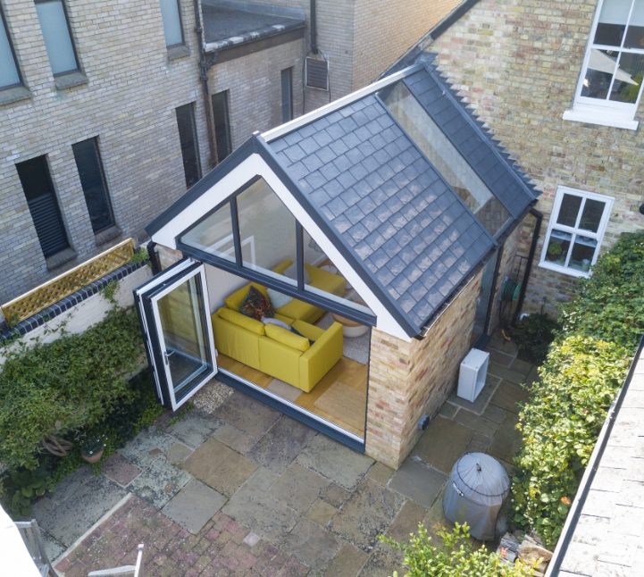 conservatory with a tiled roof and bifold doors