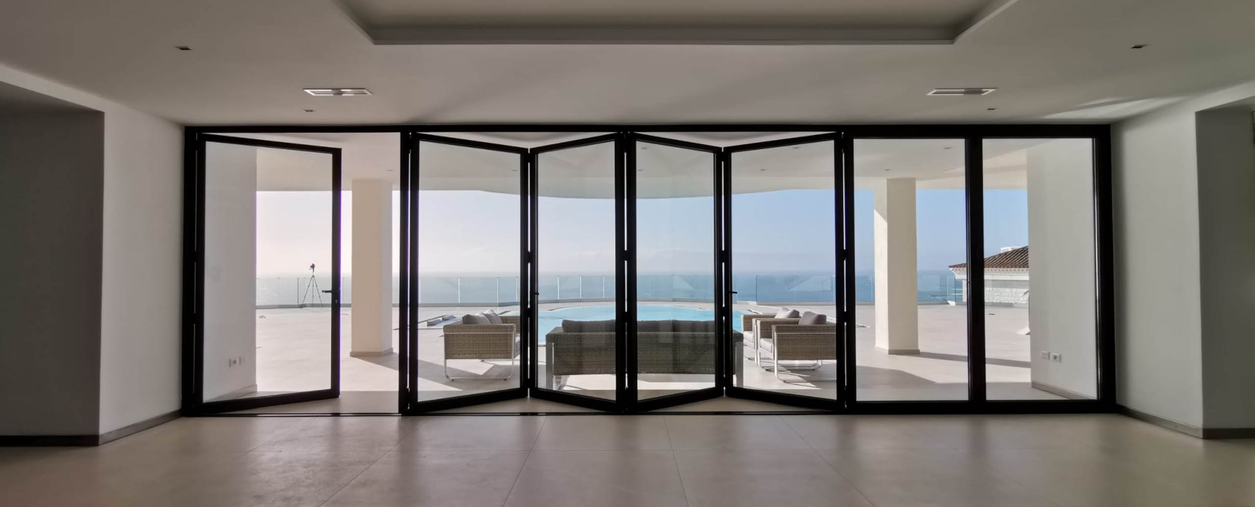 large black multi-panel bifold doors