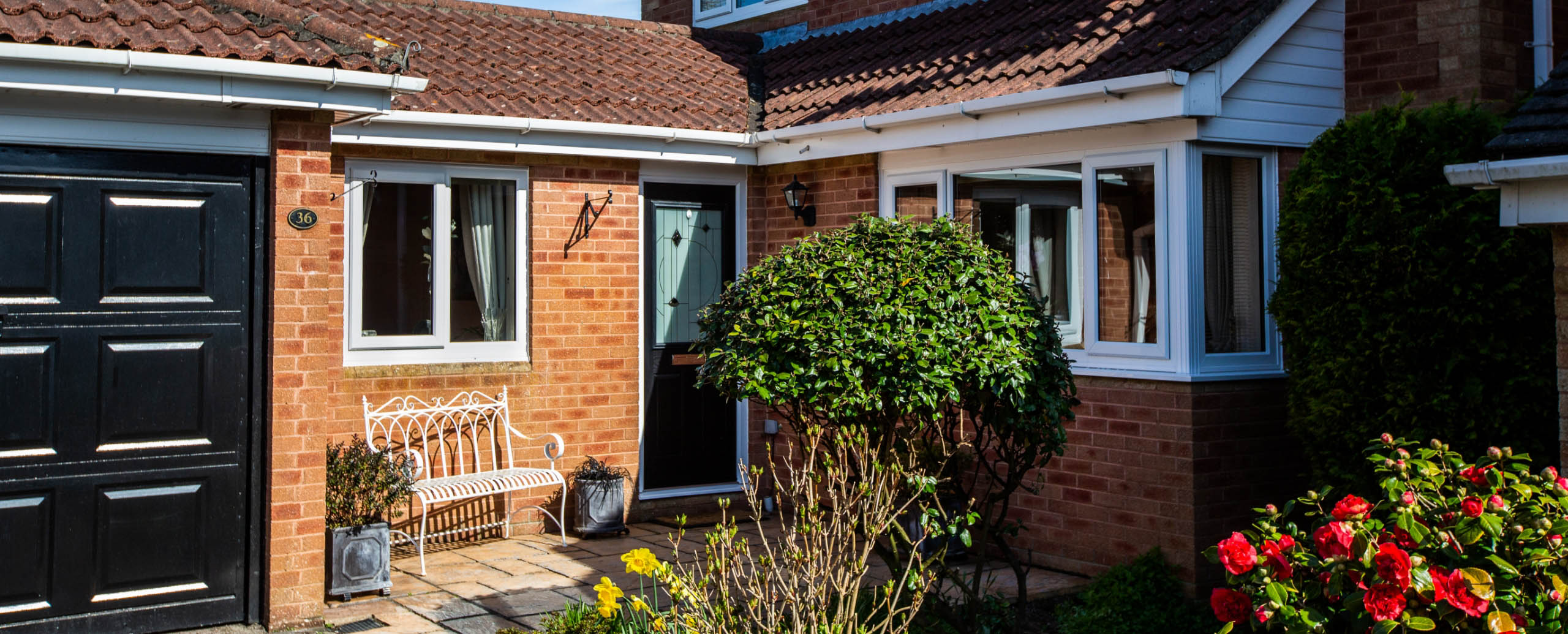 house with aluminium windows and black door