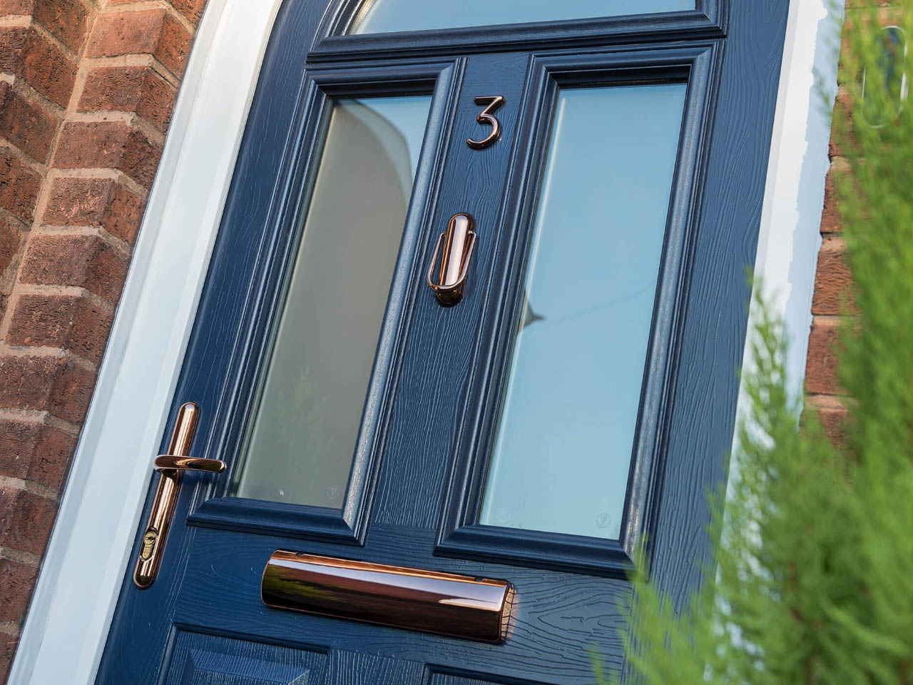 blue composite door with a wood finish