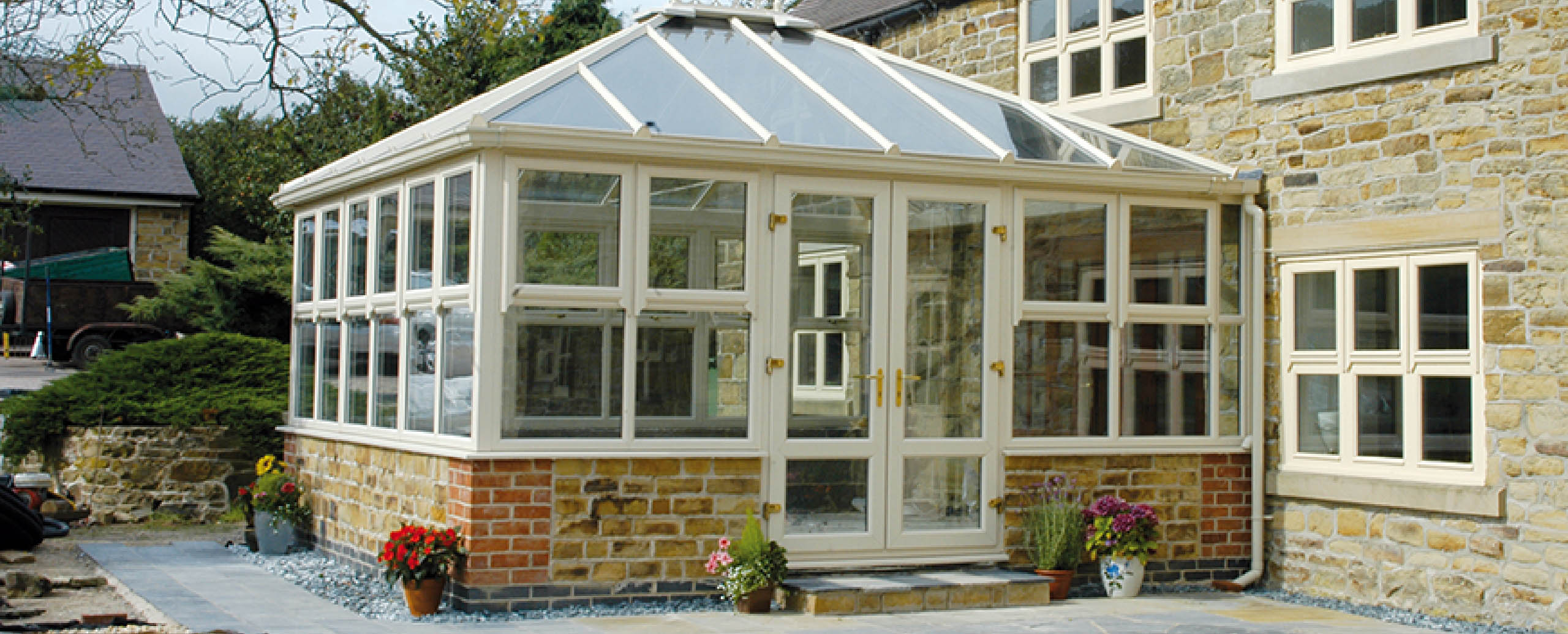 photo of white French doors installed in a conservatory