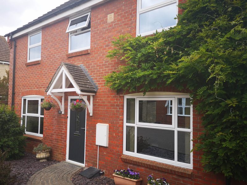 classic casement windows in a red brick house