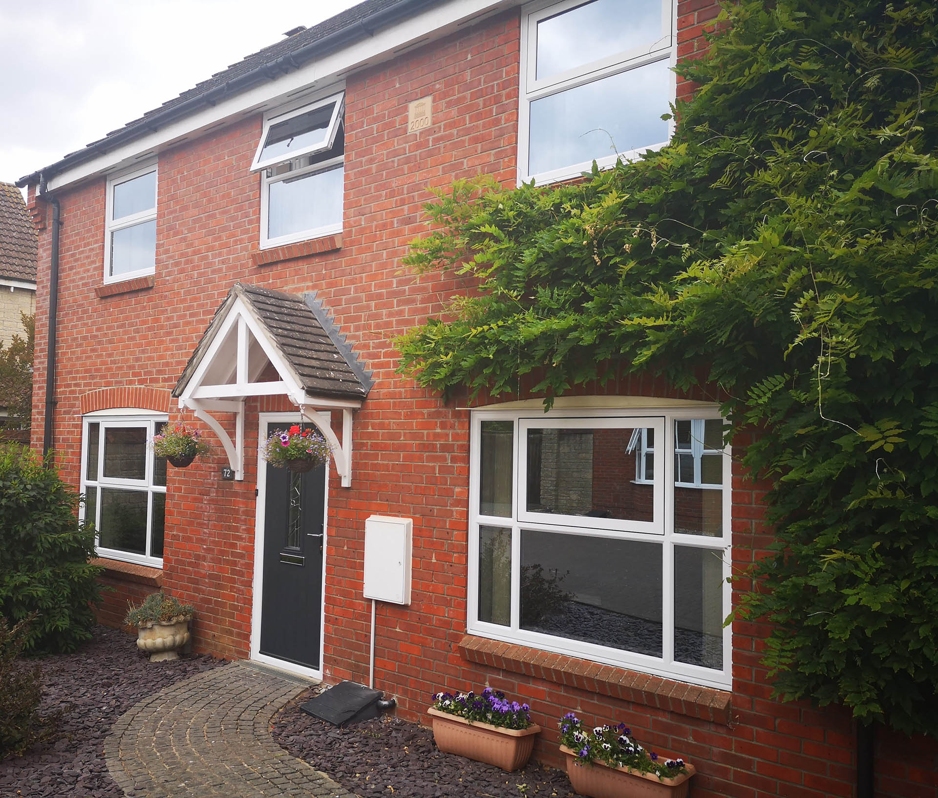 classic casement windows in a red brick house