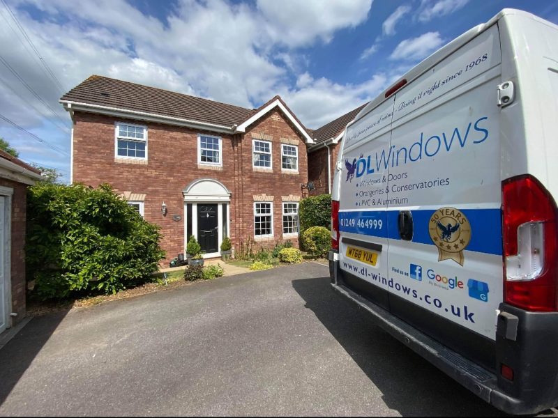 DL Windows van parked outside a house