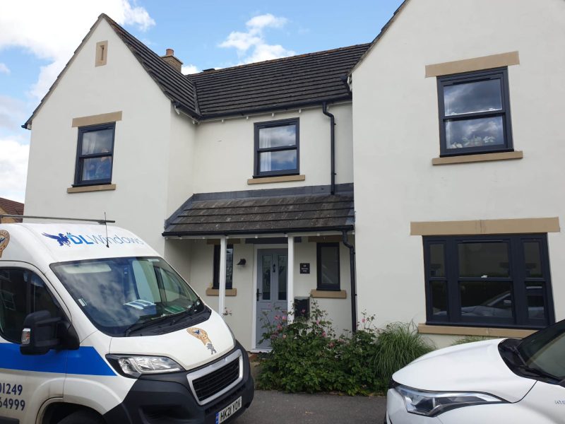 DL Windows van outside a house