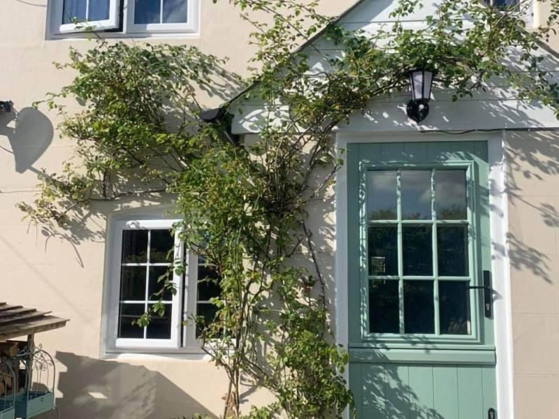 green door with large window