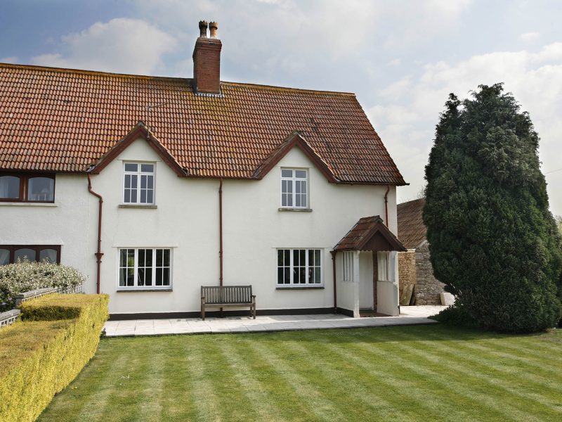 photo of a white house with new windows