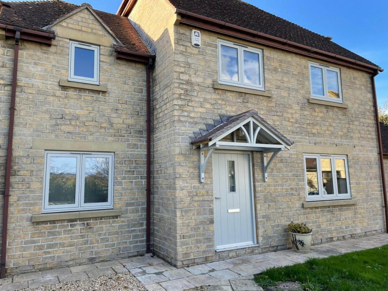 photo of a house with a light green front door