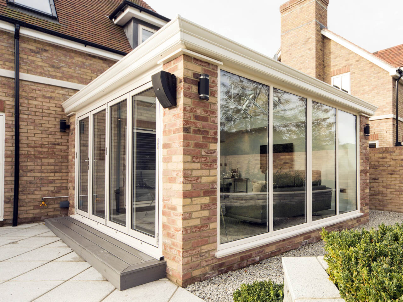 brick orangery with white doors