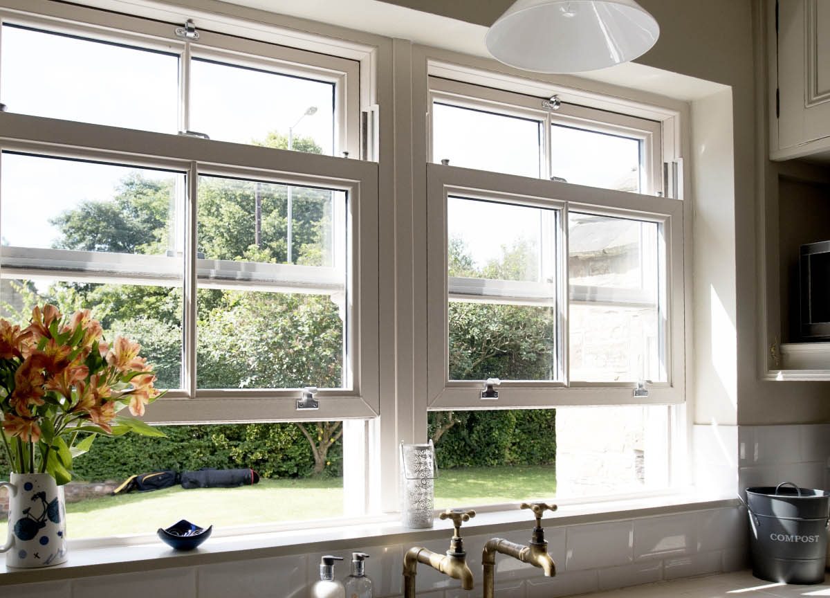 interior view of white sliding sash windows next to a sink